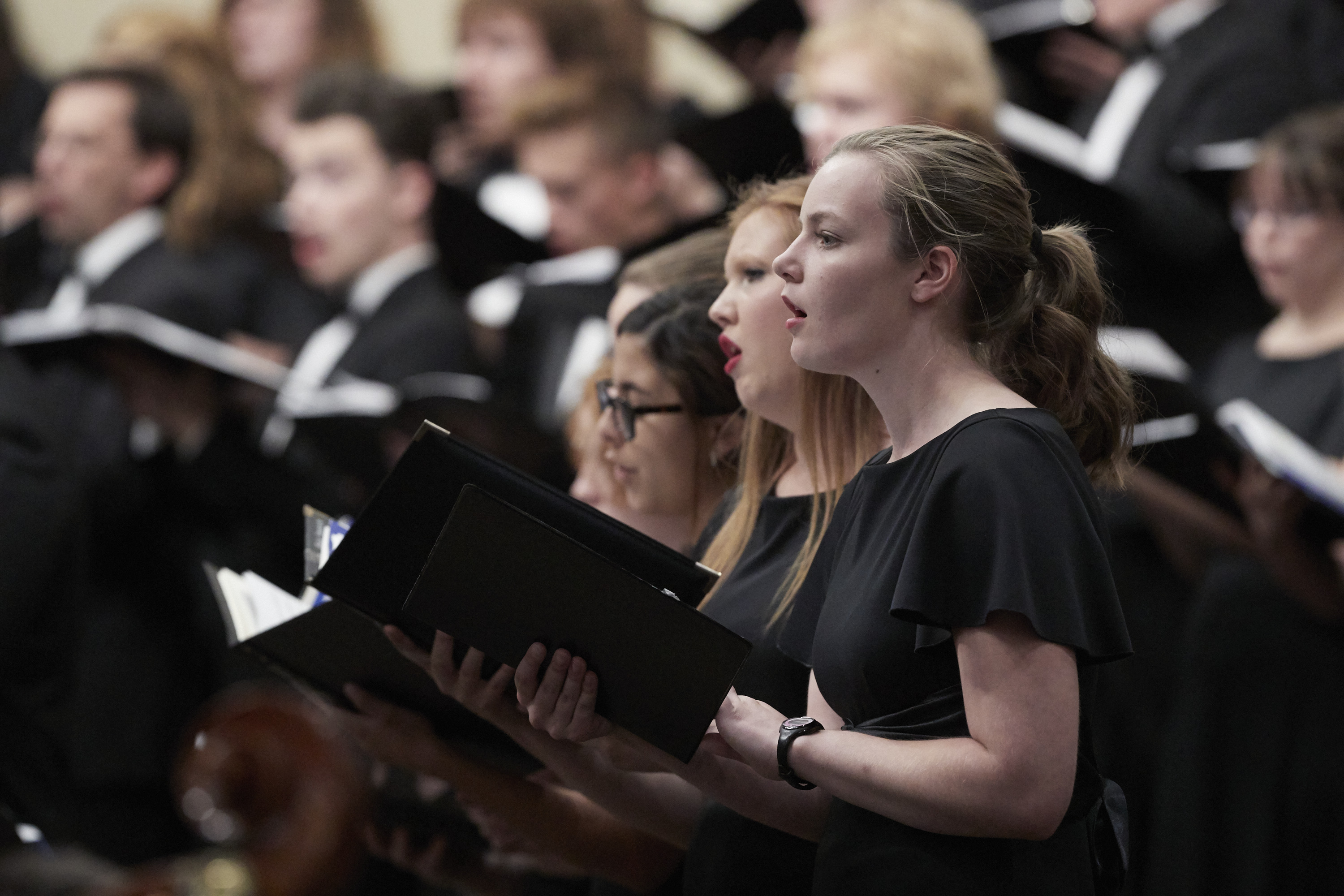 Choir Society perform and sing in a large group performance