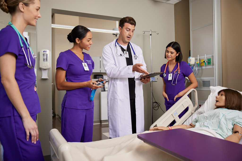 ABSN students work bedside