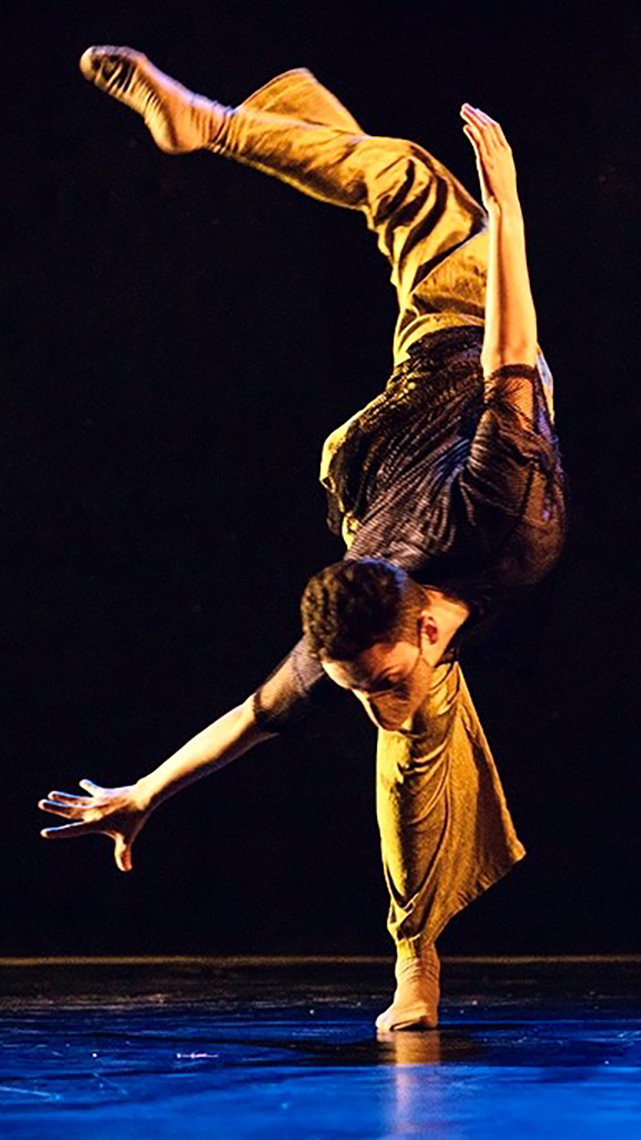 Jonathan Montoya Gerardo in an arabesque movement during a dance showcase
