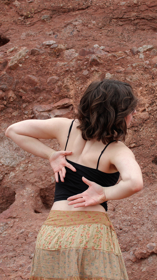 Dancer with hands behind back